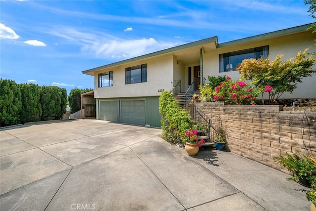6058 Joan Pl, San Luis Obispo, CA 93401 - single story home featuring an attached garage, stucco siding, driveway, and stairway