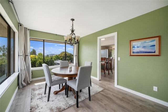 6058 Joan Pl, San Luis Obispo, CA 93401 - dining space with a chandelier and wood finished floors