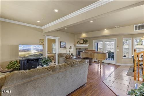 26941 Stirrup Way, Tehachapi, CA 93561 - living area with a fireplace, ornamental molding, baseboards, recessed lighting, and wood finished floors