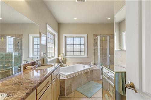 26941 Stirrup Way, Tehachapi, CA 93561 - full bathroom with tile patterned floors, a bath, a stall shower, vanity, and recessed lighting