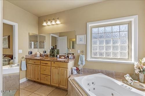 26941 Stirrup Way, Tehachapi, CA 93561 - ensuite bathroom featuring vanity, a tub with jets, and tile patterned floors