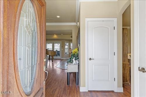 26941 Stirrup Way, Tehachapi, CA 93561 - entrance foyer with ornamental molding, baseboards, wood finished floors, and arched walkways