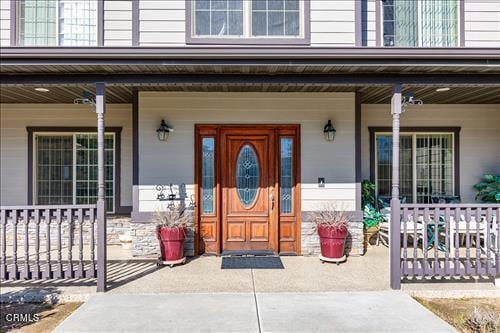 26941 Stirrup Way, Tehachapi, CA 93561 - entrance to property with a porch and stone siding