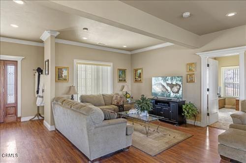 26941 Stirrup Way, Tehachapi, CA 93561 - living room with healthy amount of natural light, wood finished floors, crown molding, recessed lighting, and baseboards