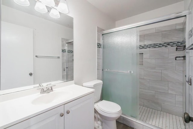 5700 Baltimore Dr Unit 134, La Mesa, CA 91942 - bathroom featuring a stall shower, toilet, and vanity