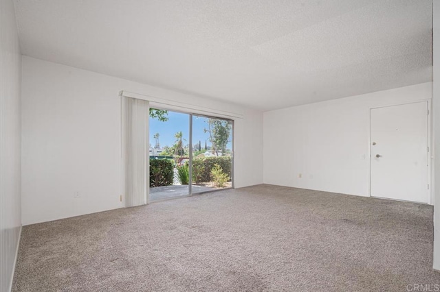 5700 Baltimore Dr Unit 134, La Mesa, CA 91942 - empty room with carpet flooring and a textured ceiling