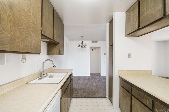 5700 Baltimore Dr Unit 134, La Mesa, CA 91942 - kitchen with a sink, light countertops, a chandelier, light floors, and dark brown cabinets