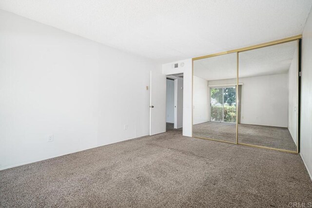 5700 Baltimore Dr Unit 134, La Mesa, CA 91942 - unfurnished bedroom featuring carpet flooring and a closet