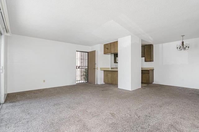 5700 Baltimore Dr Unit 134, La Mesa, CA 91942 - unfurnished living room with a chandelier, a textured ceiling, and carpet