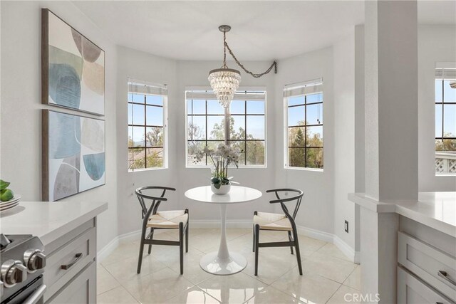 21011 Marin Unit 103, Lake Forest, CA 92630 - dining area featuring healthy amount of natural light, a chandelier, and light tile patterned flooring