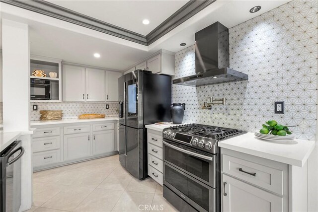 21011 Marin Unit 103, Lake Forest, CA 92630 - kitchen with wall chimney exhaust hood, stainless steel appliances, crown molding, tasteful backsplash, and light countertops