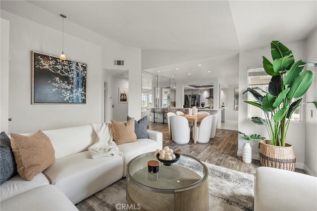 21011 Marin Unit 103, Lake Forest, CA 92630 - living area featuring lofted ceiling and wood finished floors