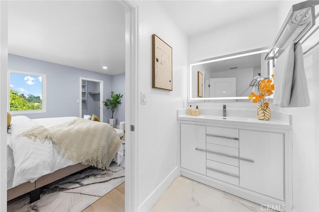11636 Lambert Ave Unit 12, El Monte, CA 91732 - bedroom featuring light marble finish flooring and a spacious closet