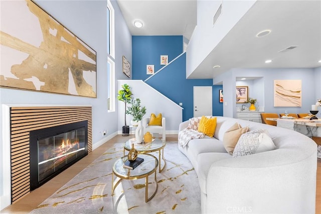 11636 Lambert Ave Unit 12, El Monte, CA 91732 - living area with wood finished floors, a glass covered fireplace, and recessed lighting