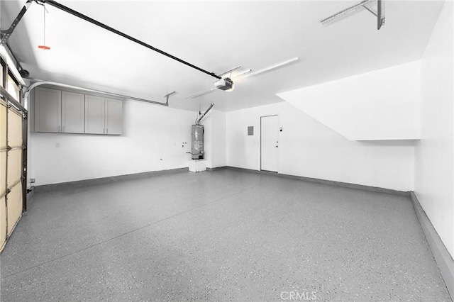 11636 Lambert Ave Unit 12, El Monte, CA 91732 - garage with strapped water heater and a garage door opener