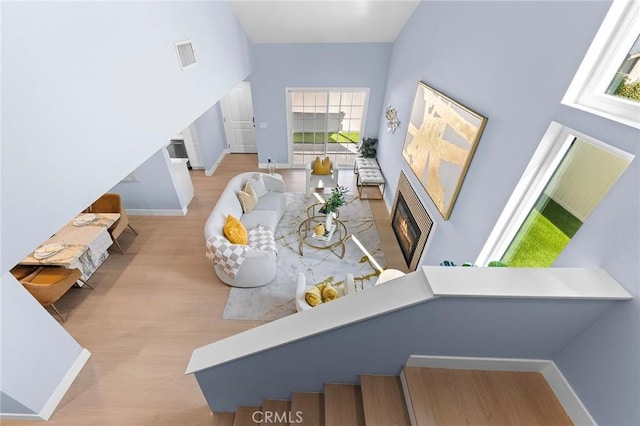 11636 Lambert Ave Unit 12, El Monte, CA 91732 - dining space with wood finished floors and a warm lit fireplace