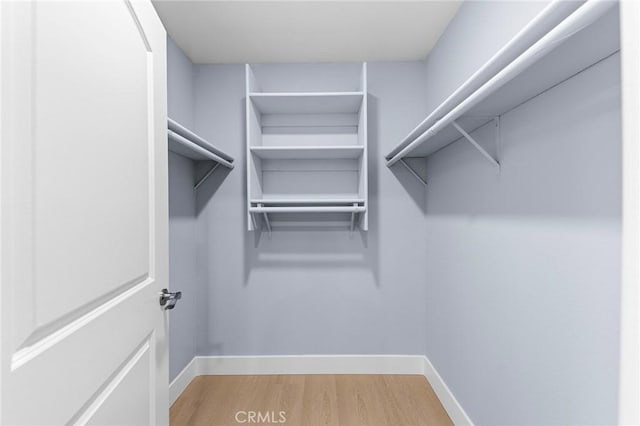 11636 Lambert Ave Unit 12, El Monte, CA 91732 - walk in closet with light wood finished floors
