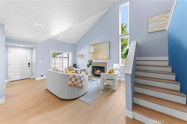 11636 Lambert Ave Unit 12, El Monte, CA 91732 - living room with wood finished floors, stairway, a fireplace, and high vaulted ceiling