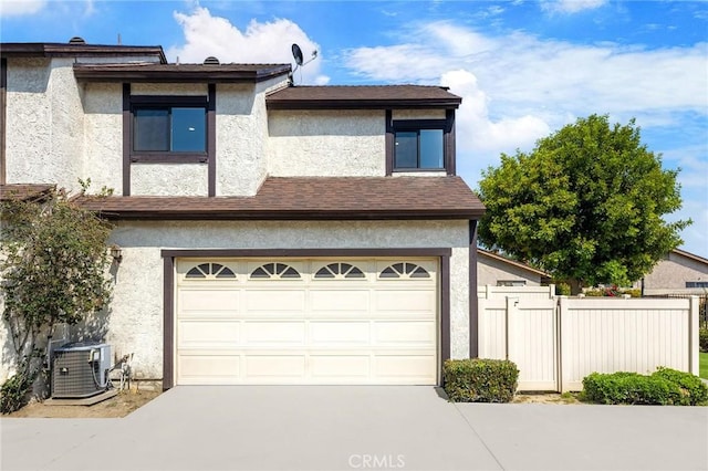 11636 Lambert Ave Unit 12, El Monte, CA 91732 - view of front of home with stucco siding, concrete driveway, and a garage