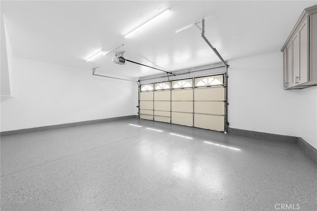 11636 Lambert Ave Unit 12, El Monte, CA 91732 - garage with a garage door opener and baseboards