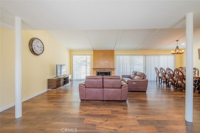19941 Hiawatha St, Chatsworth, CA 91311 - living room featuring a chandelier, wood finished floors, baseboards, and a fireplace