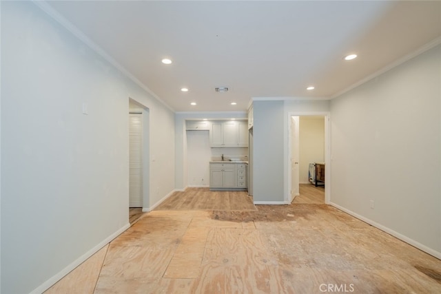 19941 Hiawatha St, Chatsworth, CA 91311 - unfurnished living room with ornamental molding, recessed lighting, baseboards, and a sink