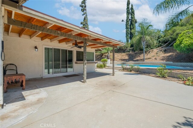 19941 Hiawatha St, Chatsworth, CA 91311 - view of patio / terrace with ceiling fan and an outdoor pool