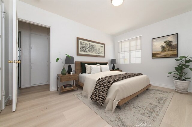 525 W Markland Dr, Monterey Park, CA 91754 - bedroom featuring light wood-style floors and baseboards