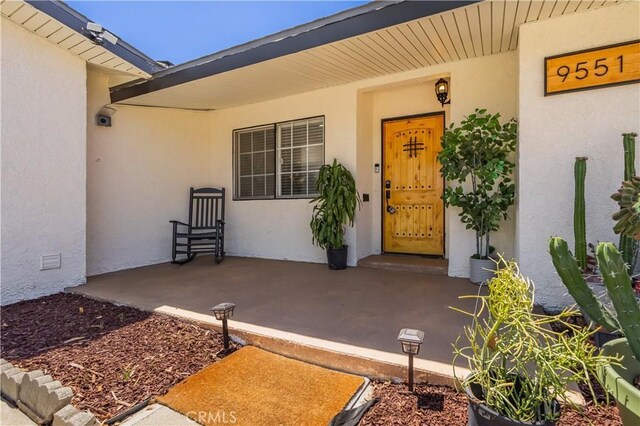 9551 Barkerville Ave, Whittier, CA 90605 - view of exterior entry featuring stucco siding