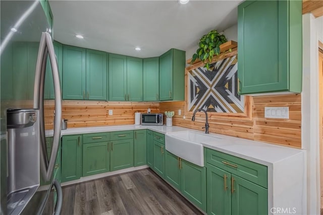 9551 Barkerville Ave, Whittier, CA 90605 - kitchen featuring stainless steel appliances, a sink, light countertops, dark wood-style floors, and green cabinetry