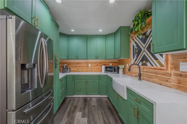 9551 Barkerville Ave, Whittier, CA 90605 - kitchen with stainless steel appliances, green cabinets, a sink, light countertops, and dark wood-type flooring