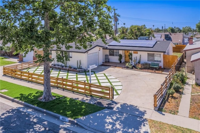 9551 Barkerville Ave, Whittier, CA 90605 - ranch-style home featuring a fenced front yard, concrete driveway, and stucco siding