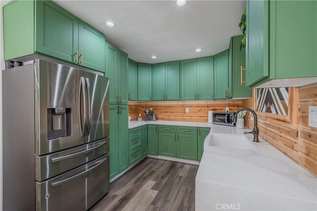 9551 Barkerville Ave, Whittier, CA 90605 - kitchen featuring appliances with stainless steel finishes, a sink, green cabinetry, dark wood-type flooring, and recessed lighting