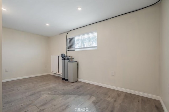 9551 Barkerville Ave, Whittier, CA 90605 - empty room with baseboards, wood finished floors, and recessed lighting