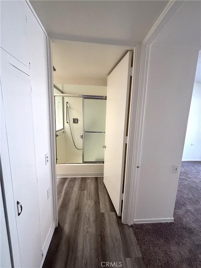 13540 Saint Andrews Dr Unit M14-4J, Seal Beach, CA 90740 - hallway featuring dark wood-style floors and baseboards