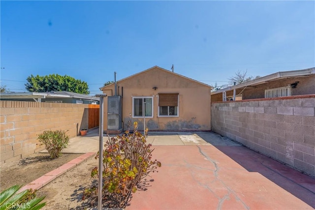 11909 Lowemont St, Norwalk, CA 90650 - back of house featuring stucco siding and a patio