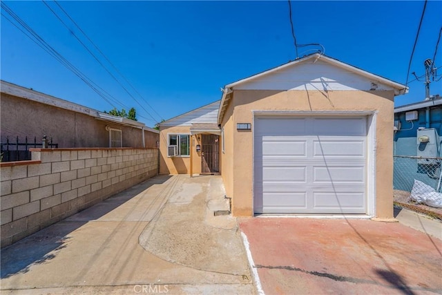 11909 Lowemont St, Norwalk, CA 90650 - view of front facade featuring stucco siding and a garage