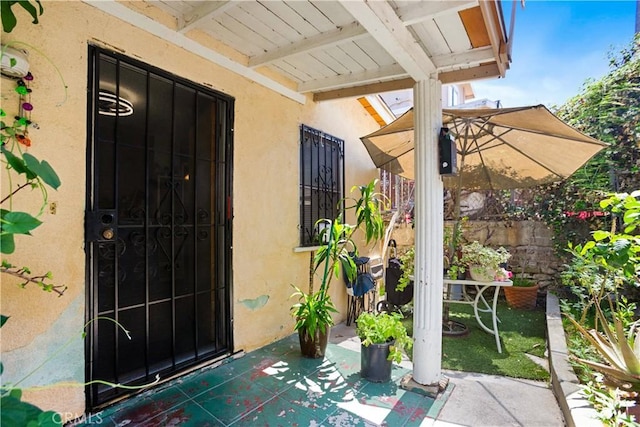 3339 E 4th St, Los Angeles, CA 90063 - property entrance featuring stucco siding and a patio area