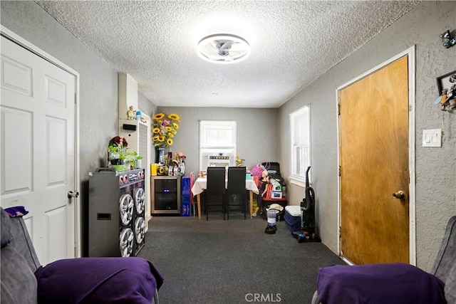 3339 E 4th St, Los Angeles, CA 90063 - game room with a textured ceiling, a textured wall, and carpet flooring