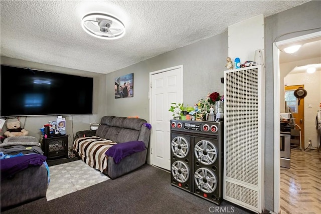 3339 E 4th St, Los Angeles, CA 90063 - living area featuring a heating unit, a textured ceiling, and arched walkways