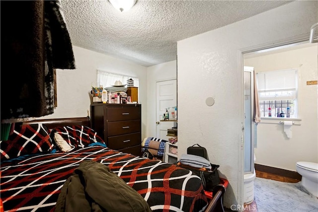 3339 E 4th St, Los Angeles, CA 90063 - bedroom with a textured ceiling, multiple windows, and wood finished floors