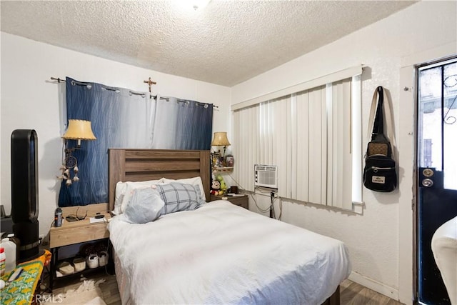 3339 E 4th St, Los Angeles, CA 90063 - bedroom featuring a textured ceiling and wood finished floors