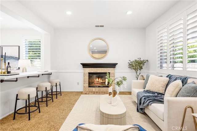 11867 Worcester Dr, Rancho Cucamonga, CA 91730 - living room featuring a fireplace, light colored carpet, and recessed lighting