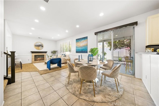 11867 Worcester Dr, Rancho Cucamonga, CA 91730 - dining room featuring light tile patterned floors, a brick fireplace, recessed lighting, and light carpet