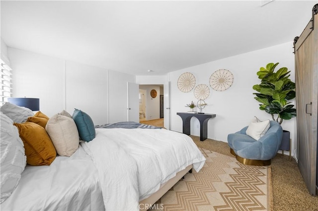 11867 Worcester Dr, Rancho Cucamonga, CA 91730 - bedroom with a barn door and light colored carpet