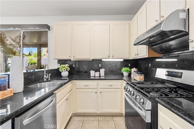 11867 Worcester Dr, Rancho Cucamonga, CA 91730 - kitchen with appliances with stainless steel finishes, under cabinet range hood, light tile patterned flooring, and backsplash