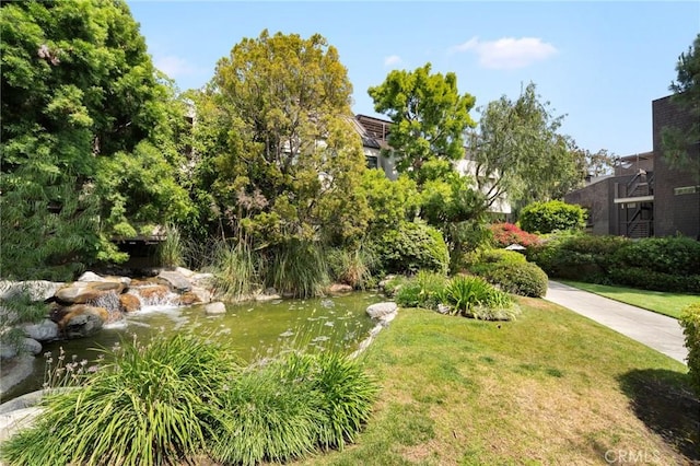 950 N Kings Rd Unit 160, West Hollywood, CA 90069 - view of green lawn featuring a garden pond