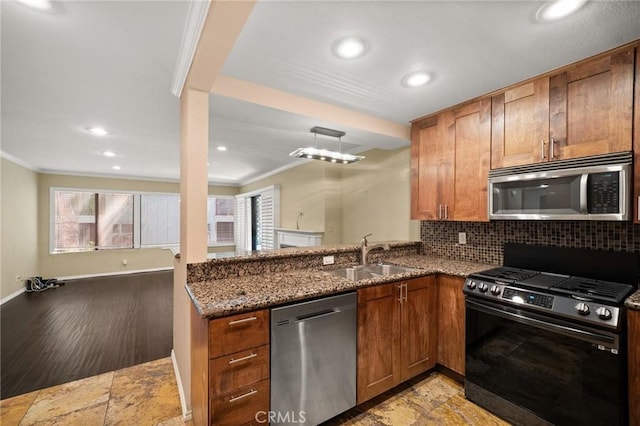 950 N Kings Rd Unit 160, West Hollywood, CA 90069 - kitchen with stainless steel appliances, ornamental molding, dark stone countertops, plenty of natural light, and recessed lighting
