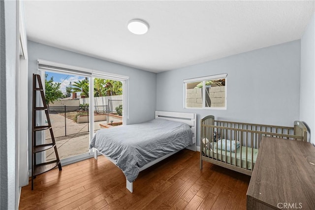 5345 Kenwood Ave, Buena Park, CA 90621 - bedroom featuring wood finished floors and access to exterior