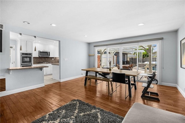 5345 Kenwood Ave, Buena Park, CA 90621 - dining room featuring light wood-type flooring, baseboards, and recessed lighting